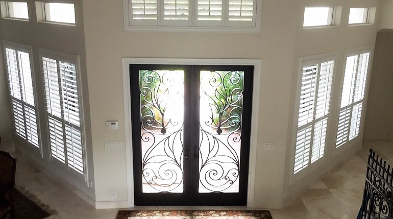 New York City foyer with glass doors and interior shutters